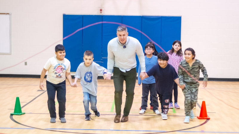 Josh runs through jump rope with students