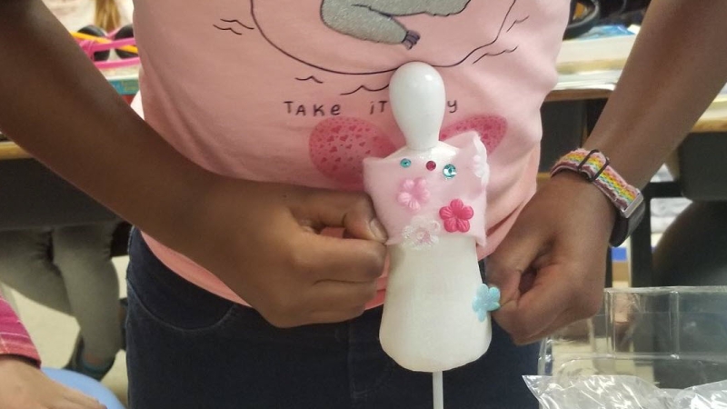 Wakefield Forest third-graders use Innovation Hour to design "fairy fashion" on a tiny clothing bust.