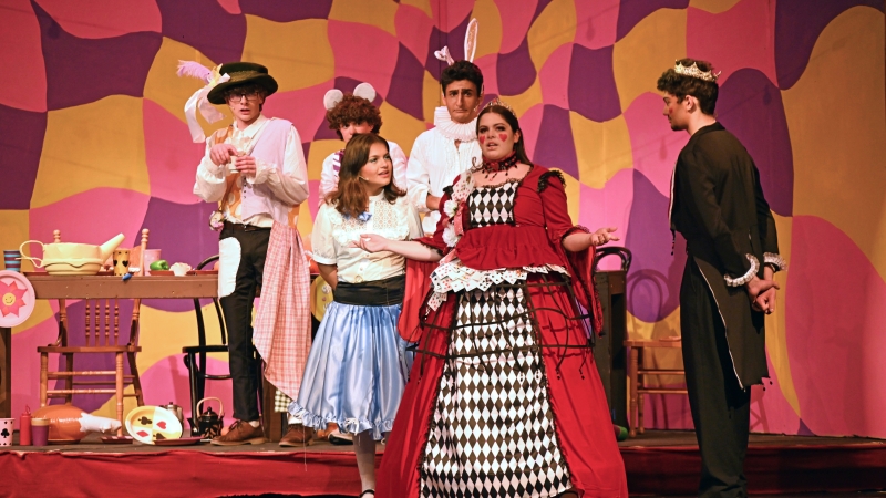 Students at Langley High School performing Alice in Wonderland.