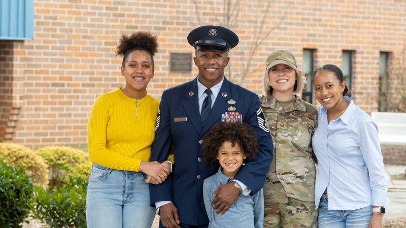 military family with husband and wife in military and three children