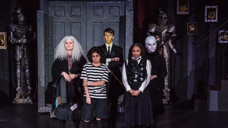 Students at Mount Vernon High School performing in The Addams Family musical. 