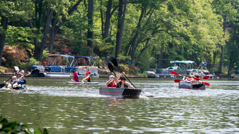 students race cardboard boats on Lake Barcroft