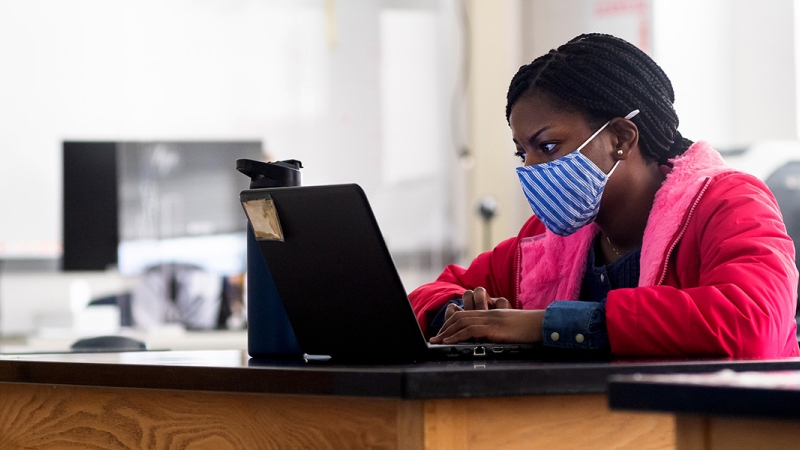 student working at laptop