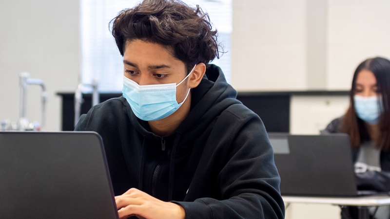 masked students in class