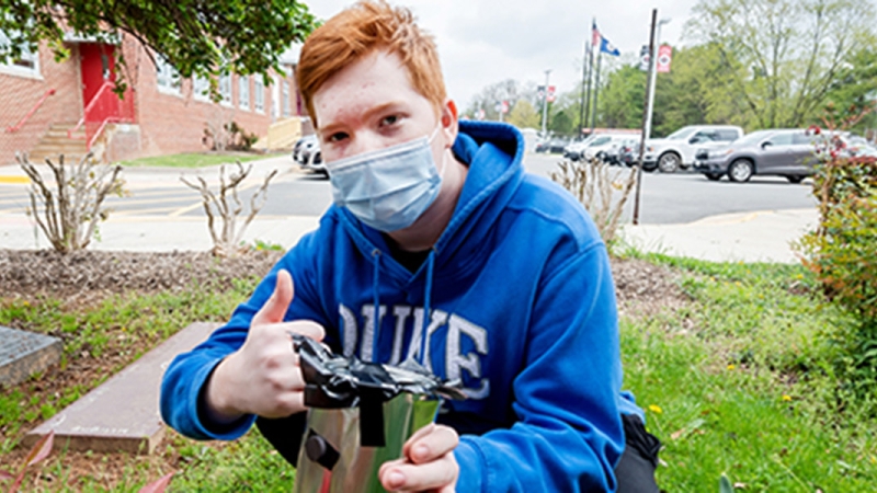 student gardening