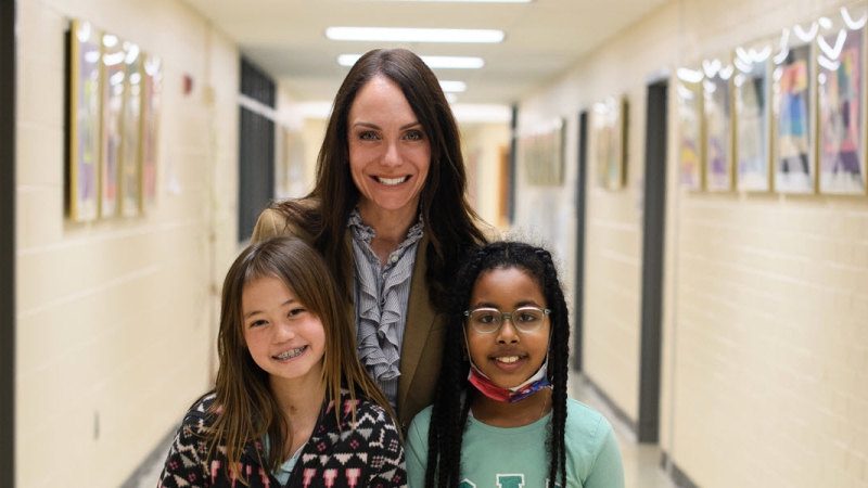 Principal Kelly Shears and two students