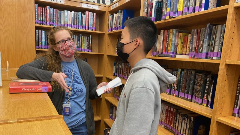 South County High Librarian Ronielle Romney chats with a student.