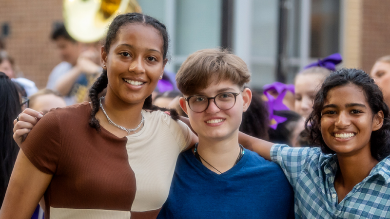 Three smiling students