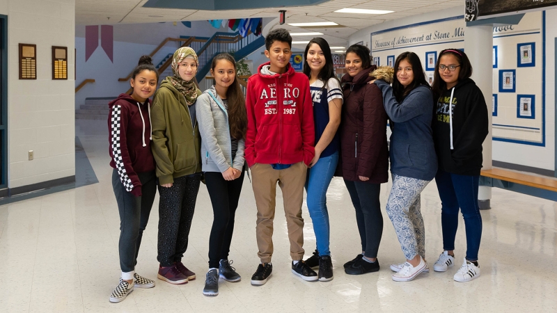 Stone Middle School students standing together in the hallway