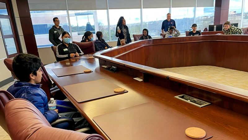 students sitting at a conference table