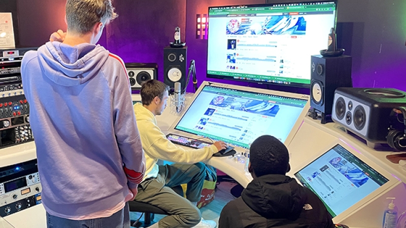 students working together in a music studio