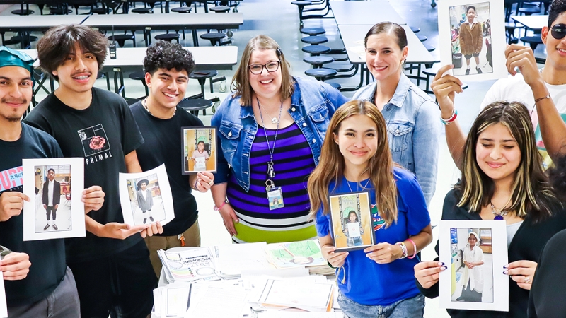 Former Lynbrook Elementary teacher Wendy Casual and her one-time sixth grade students, now high school grads, hold up items they stored in a time capsule in 2018.