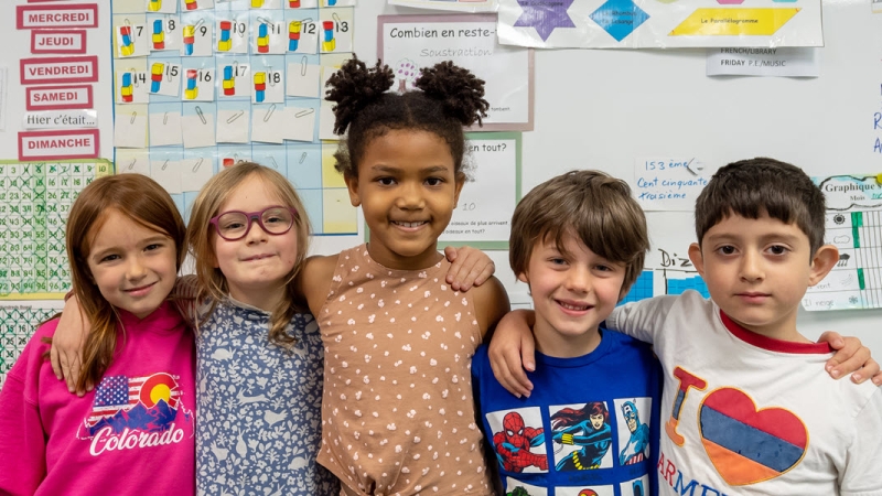 five elementary school students in classroom