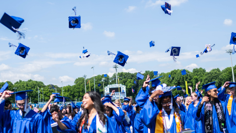 Fairfax HS students throw their caps at the Class of '24 graduation