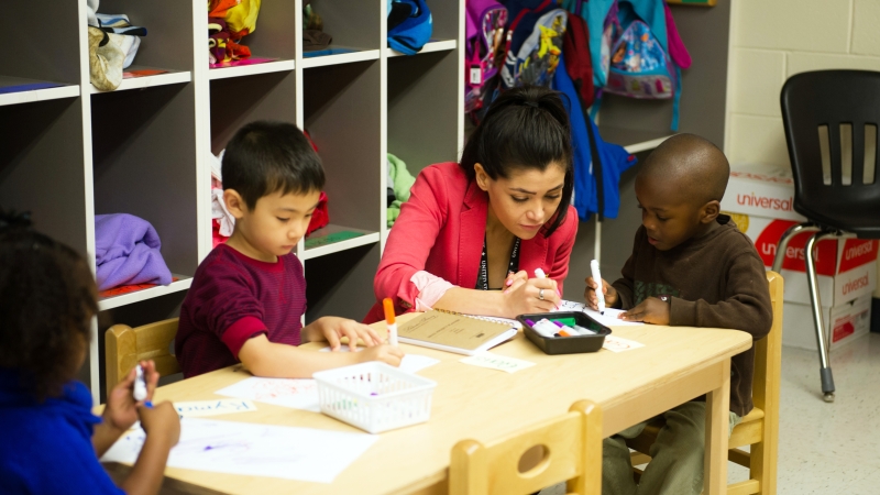 Teacher working with students.