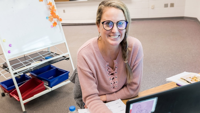 a teacher using a computer