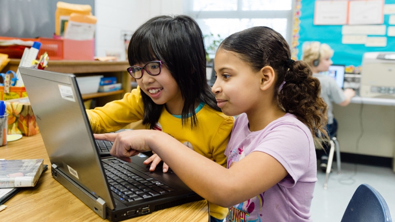 girls working on a laptop