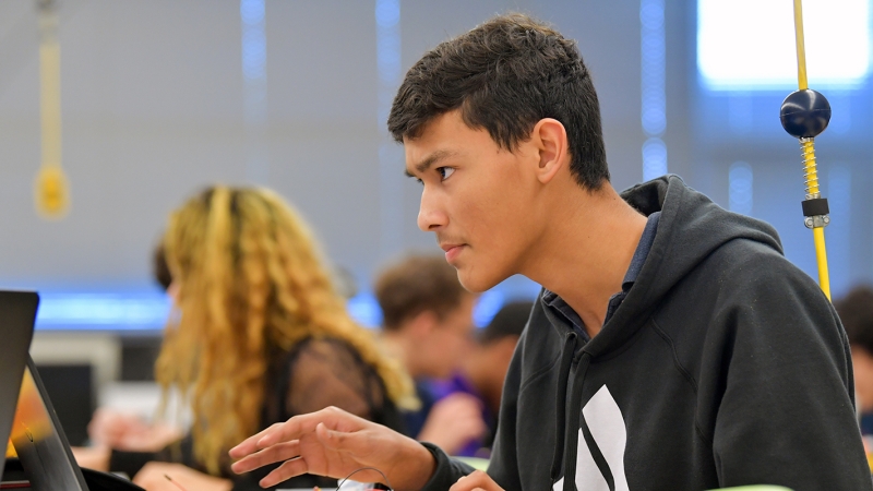 High school students concentrating on laptops