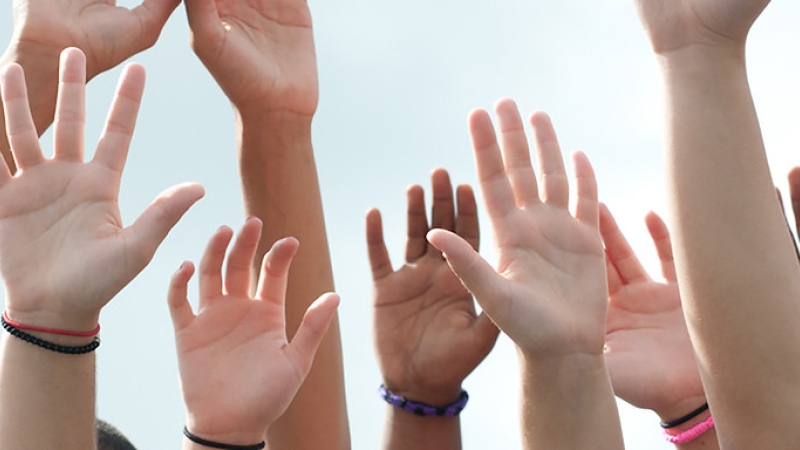 photo of hands in the air