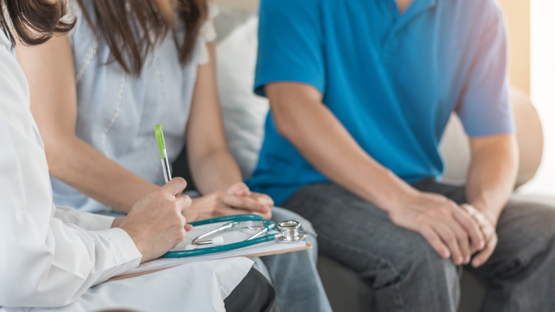 couple meeting with a doctor