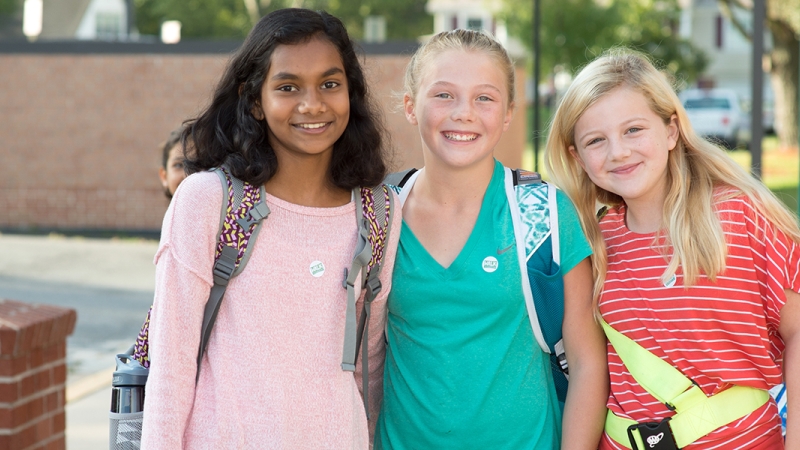 Photo of three students smiling