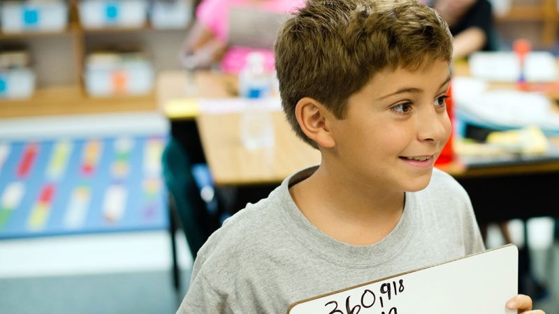 student smiling in class