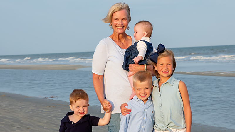 Woman and grandkids on the beach