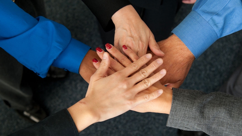 Photo of overlapping hands