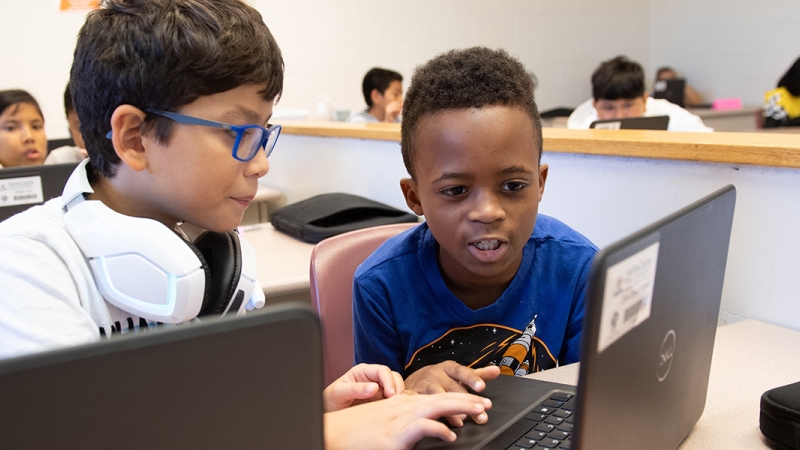 elementary school students using computers