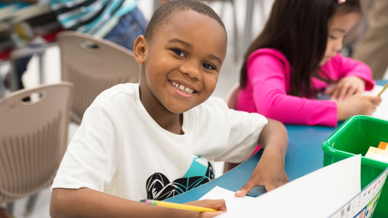 Photo of a male student at his desk