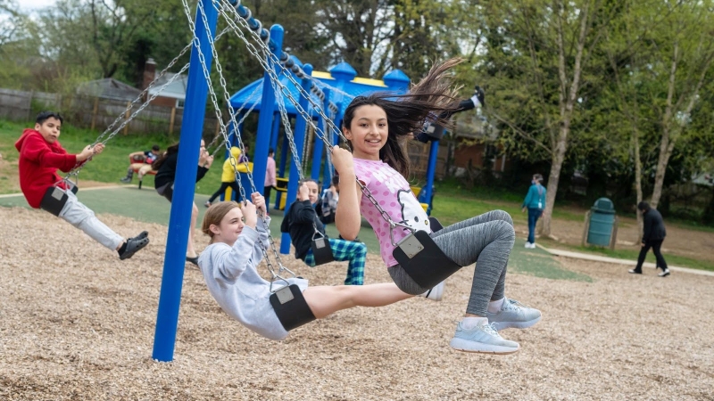 students on swings