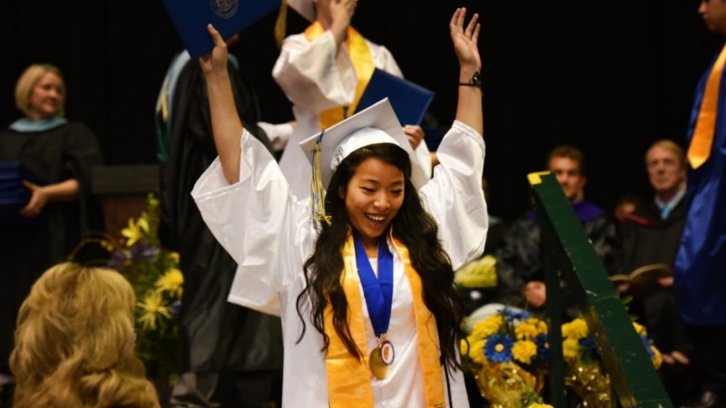 photo of a high school graduate after getting her diploma