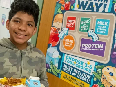 Student with food in cafeteria at school