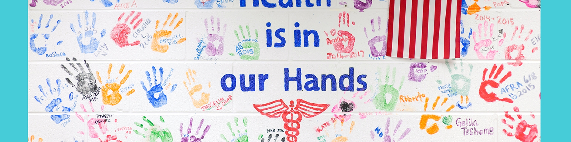 Health is in our hands painted on wall. 