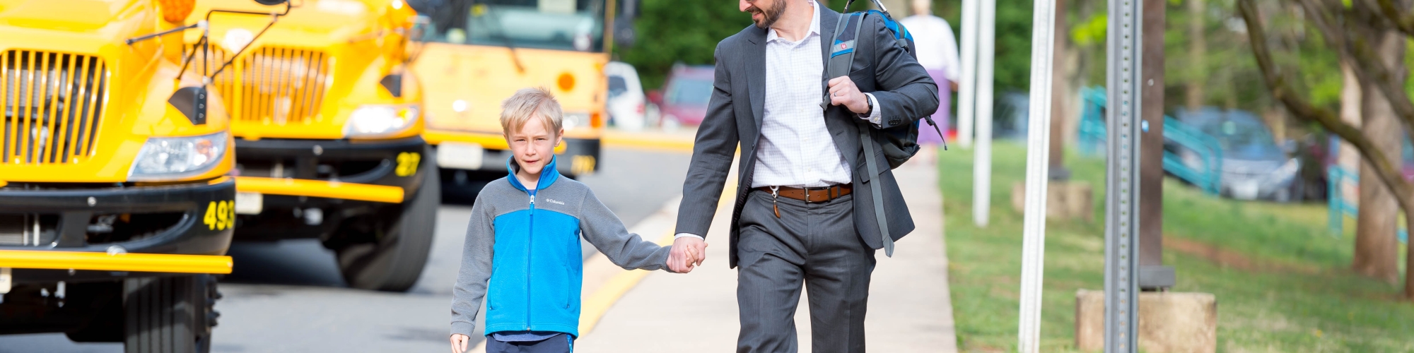 Father walking son to school