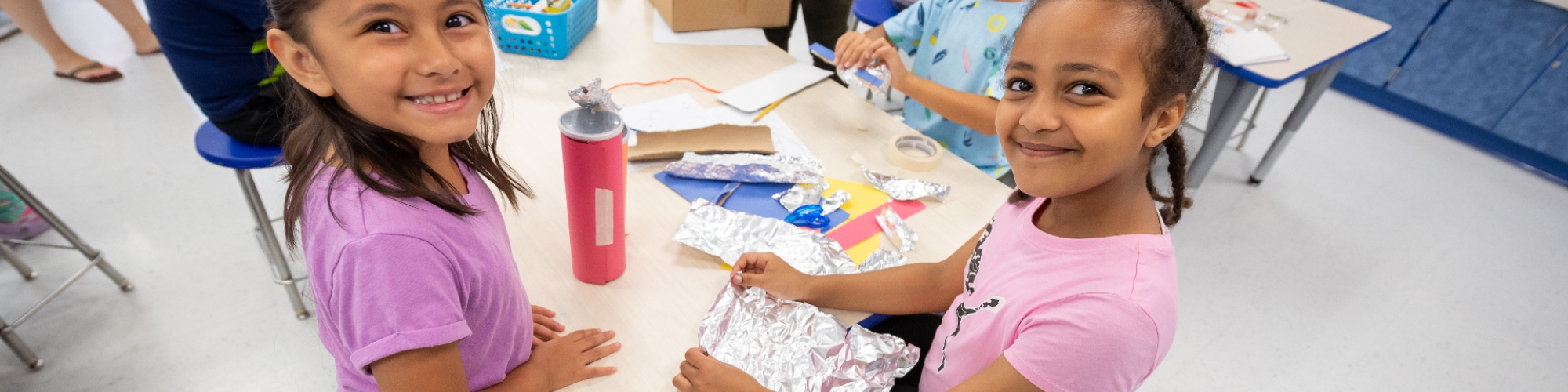 two students working together at a table