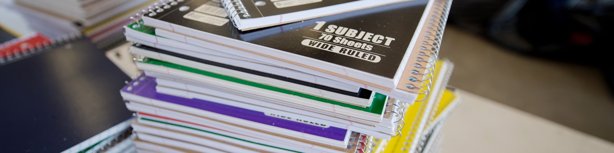 photo of a stack of spiral notebooks