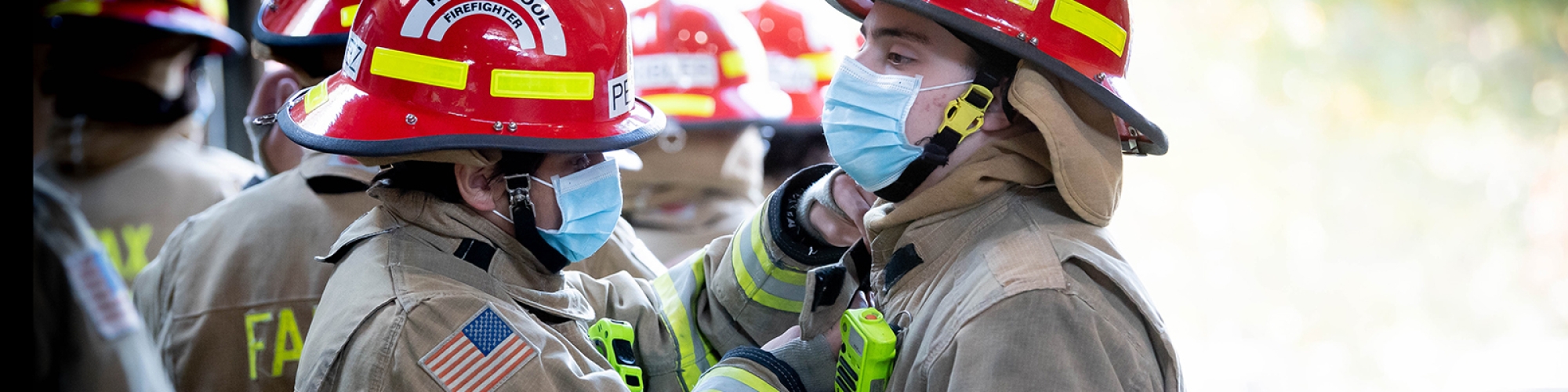 Student firefighters wearing their gear