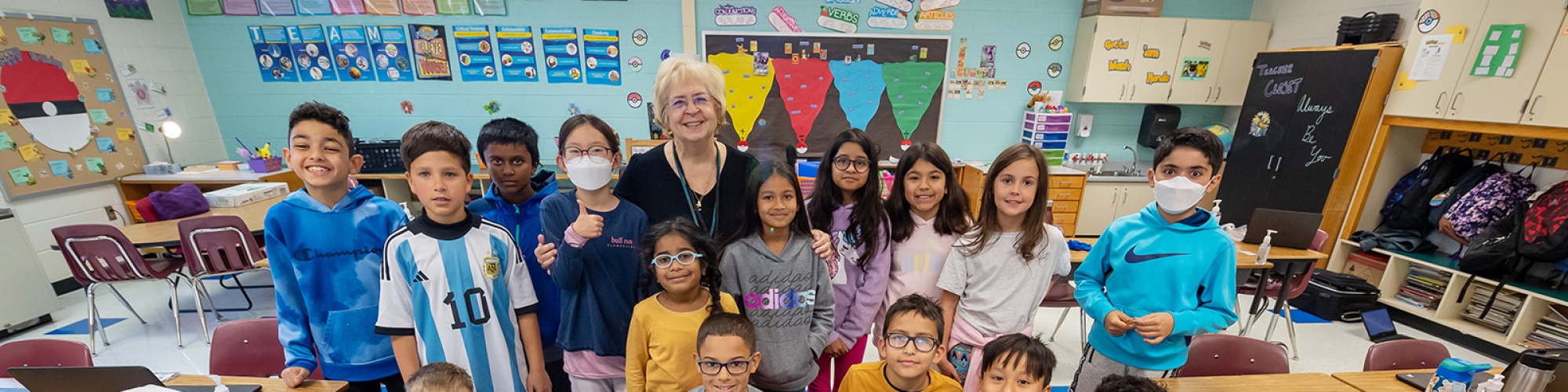 Ms. Bunni sits with group of students