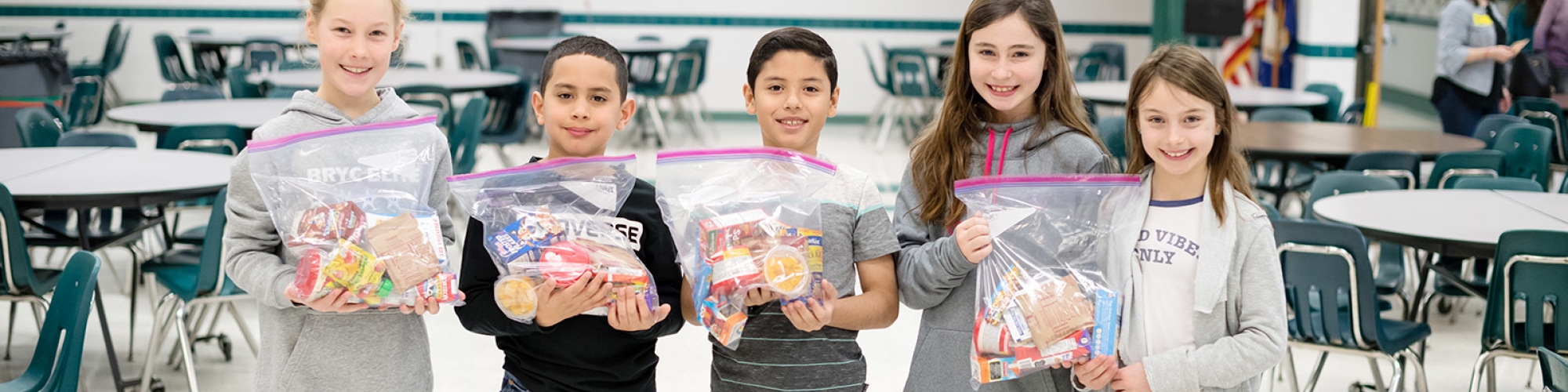 students with meals they packaged