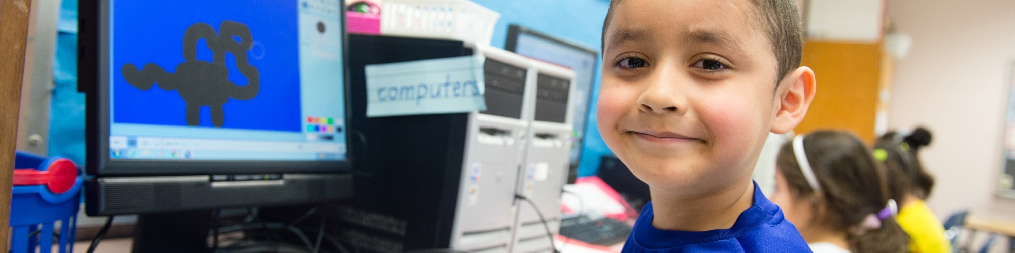 a young student working at a computer