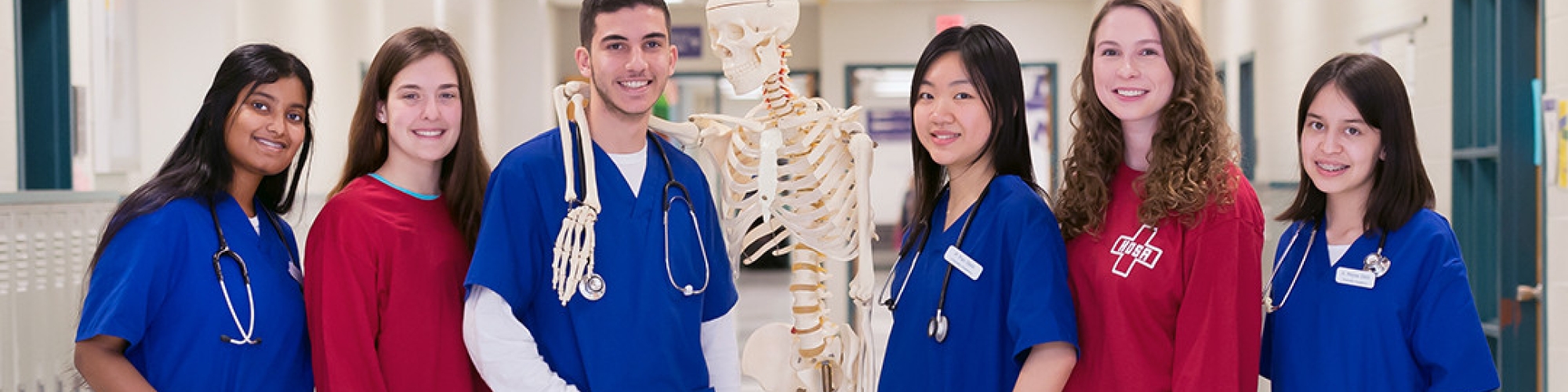 students in the medical sciences class standing in a hallway