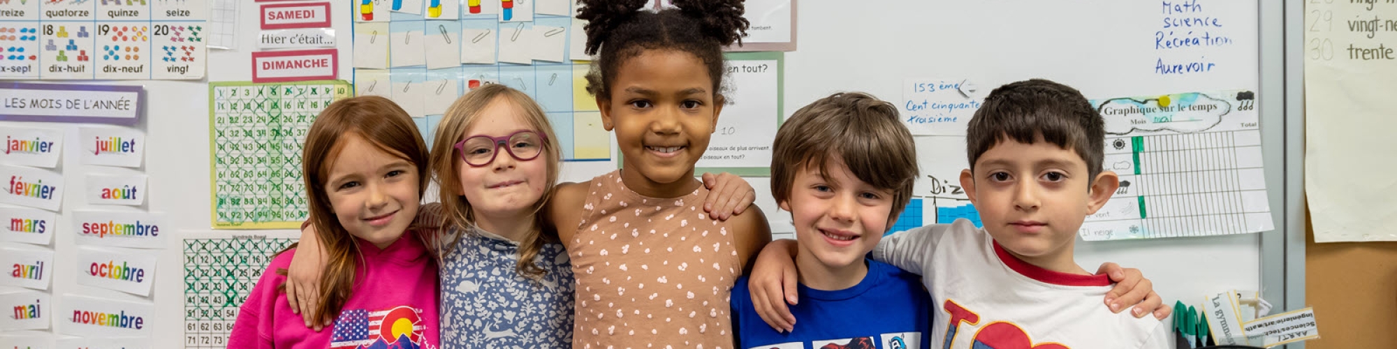 five elementary school students in classroom