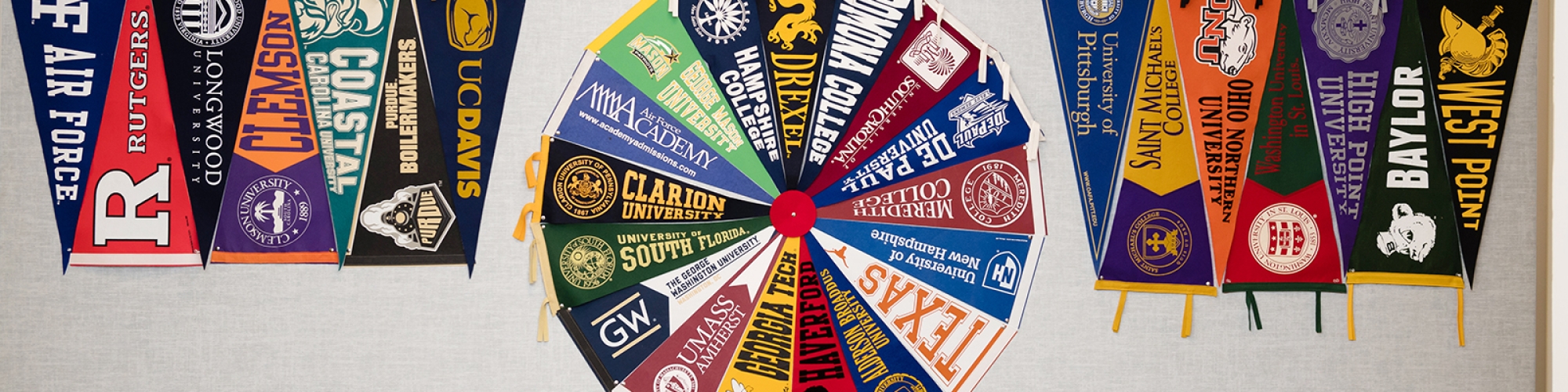 a grouping of college pennants