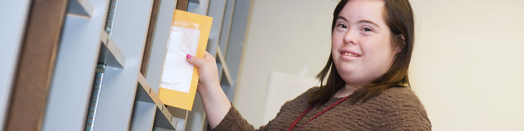 a student sorting mail