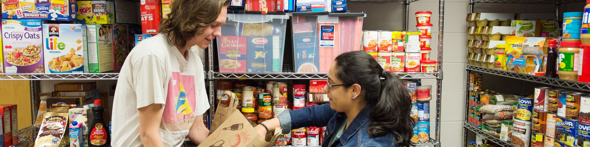 students volunteering in a school food bank