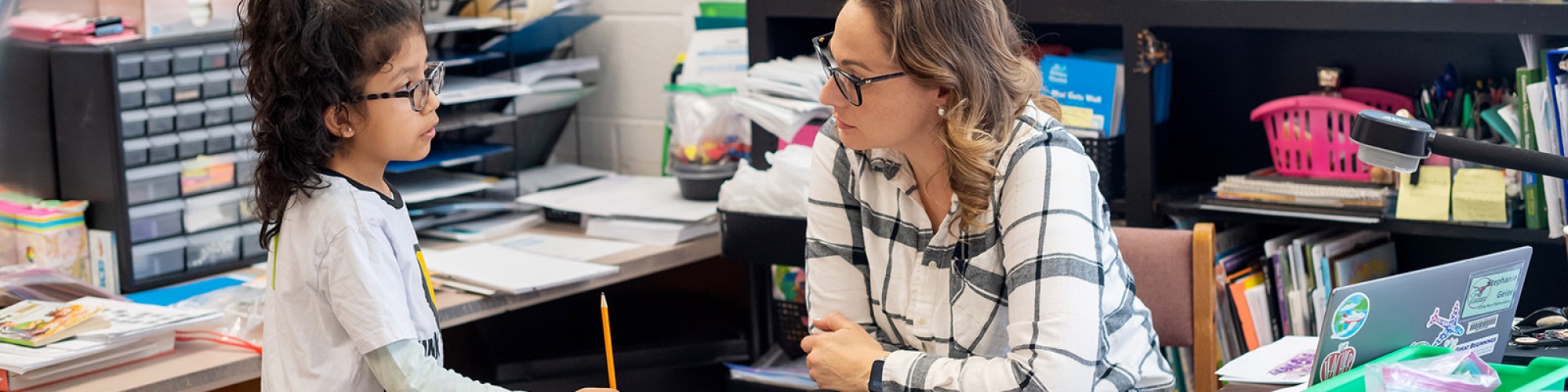 a teacher helping a student