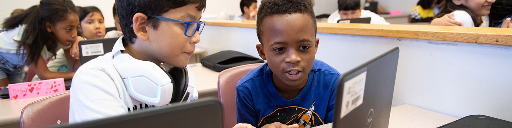 elementary school students using computers