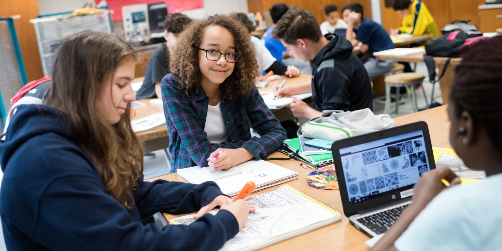 Students sitting at desks in classroom