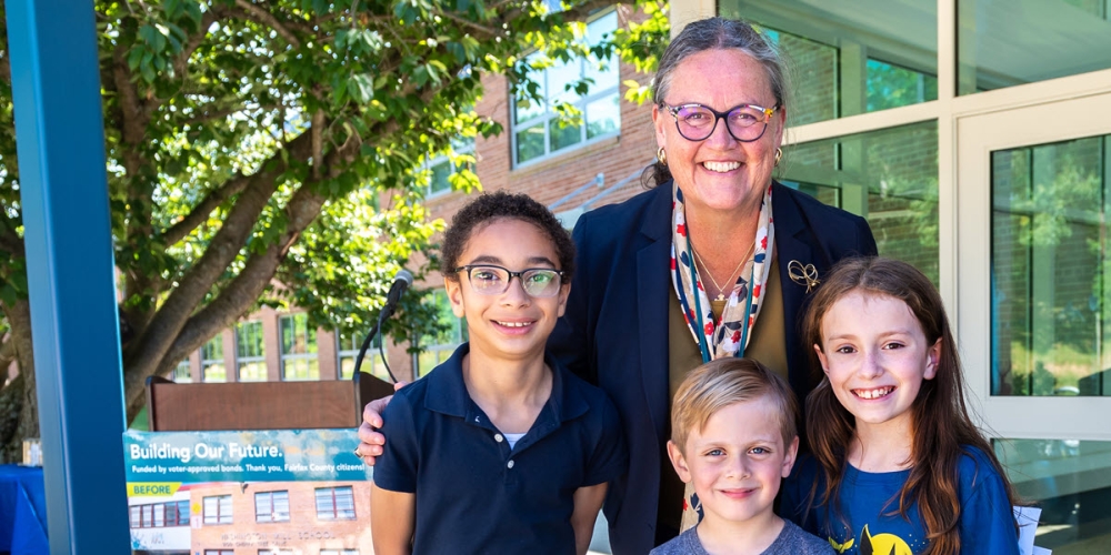 Dr. Reid with three students